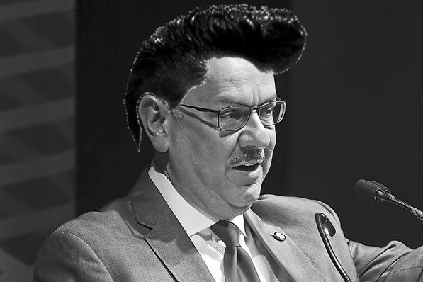 CMU President Farnam Jahanian with hair reminiscent of Elvis Presley's