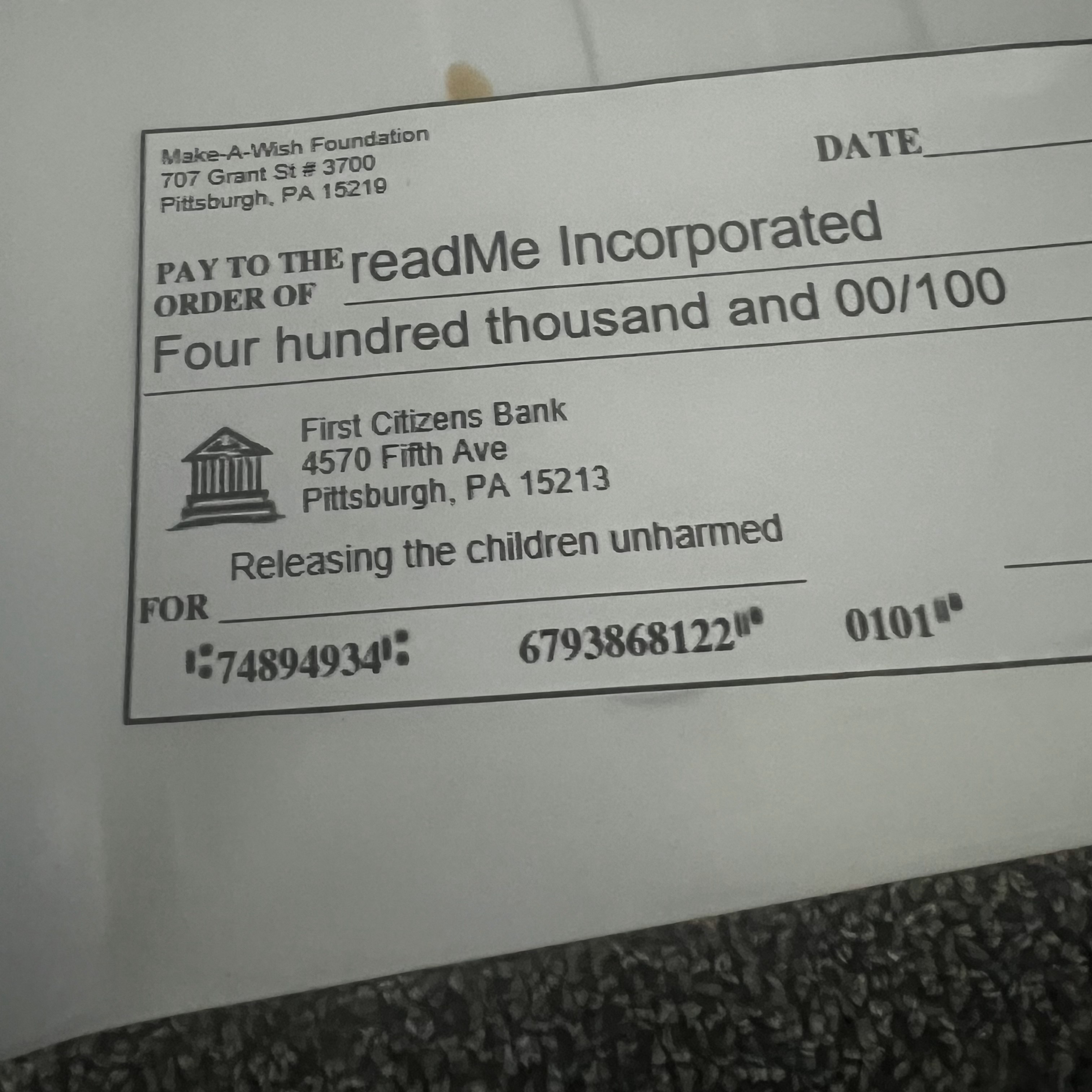 A check made out from the Make-A-Wish Foundation to readMe Incorporated for $400,000, with a memo identifying it as being for "releasing the children unharmed"